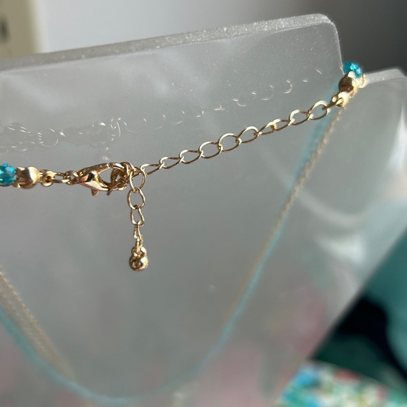 Triple strand necklace With gold tongue, chain and glass flowers, and beads - Picture 4 of 4